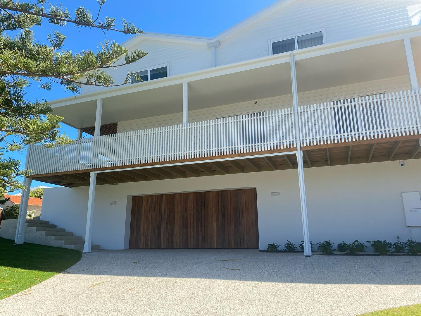 The freshly painted exterior of a white residential property